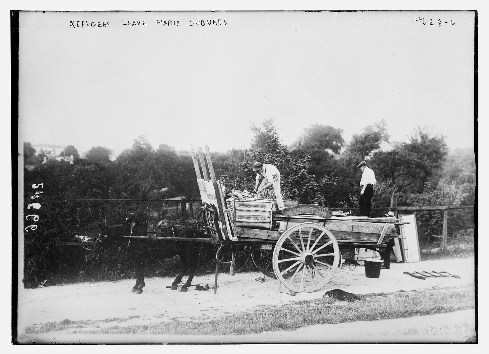 Refugees leave Paris suburbs, n/a — historic photograph