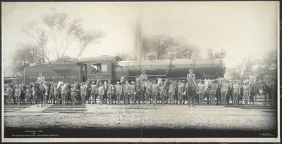 Cavalry troops and horses before Chicago & Alton locomotive 601