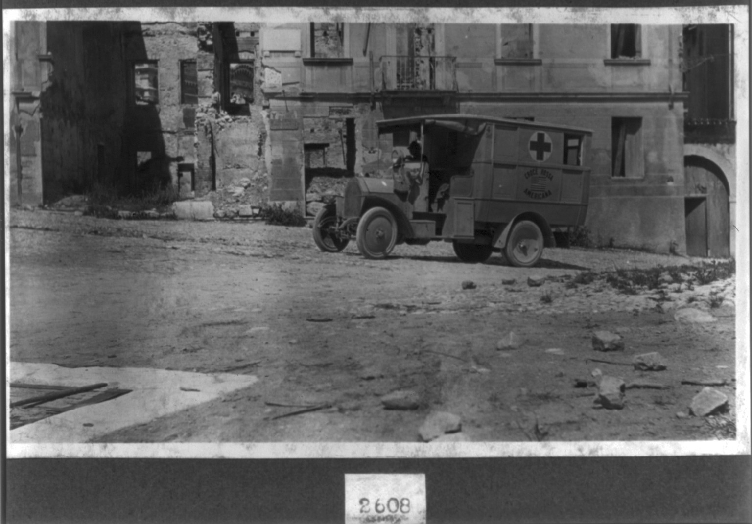[A.R.C. ambulance in a shelled town at the Front, Italy], [between 1914 and 1918] — historic photograph