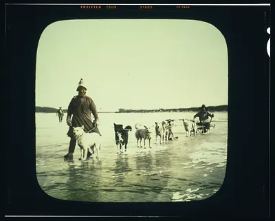 Goldi men with dog sled on Amur River