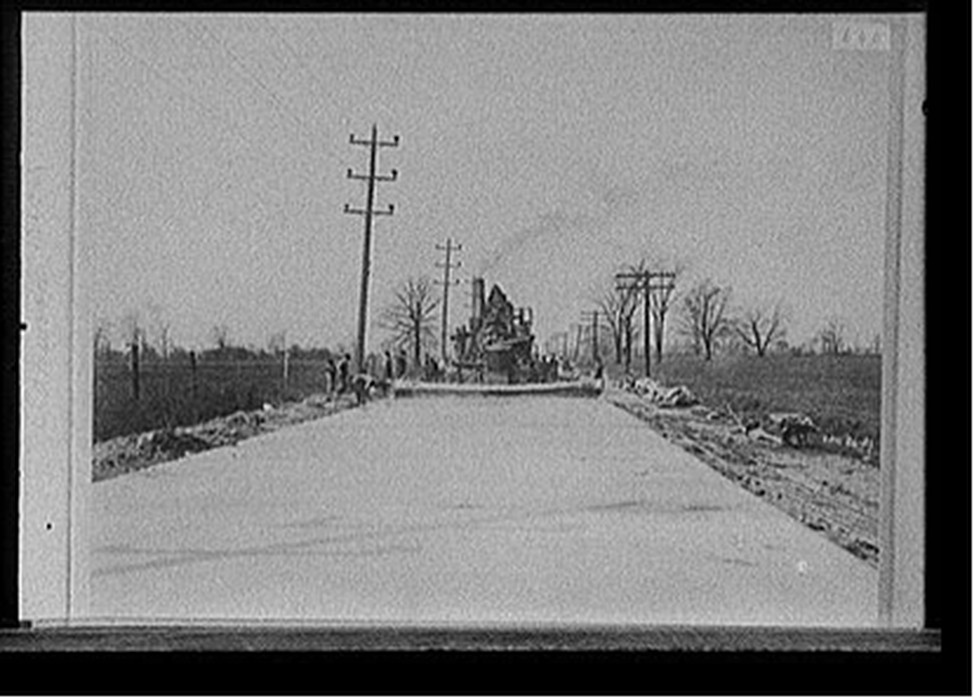 [Steamroller grading road, probably Michigan], 1921 April 26. — historic photograph