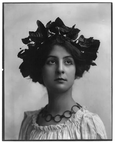 [Young woman modeling: Head and shoulders, leaves on head]