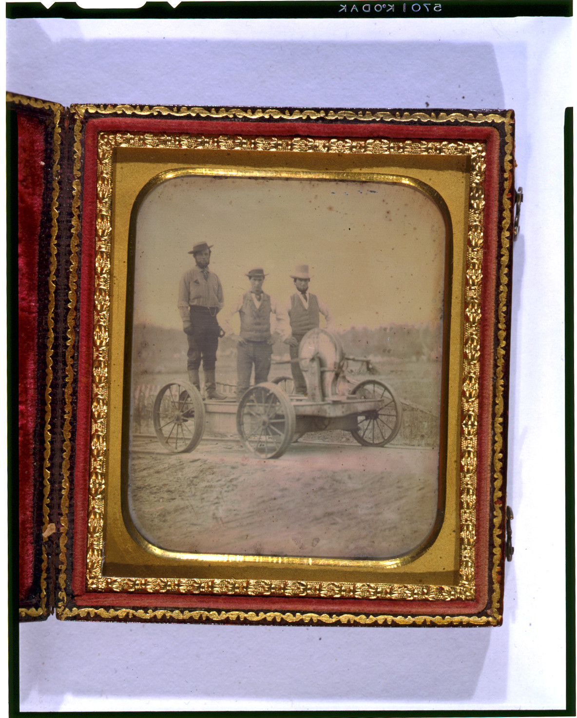 [Occupational portrait of three railroad workers standing on crank handcar], [between 1850 and 1860] — historic photograph