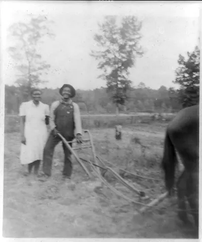 [Henry Truvillion and wife, in the garden, near Newton, Texas]