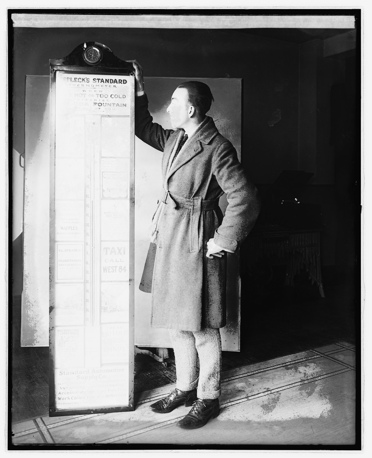Bob Marrion & thermometer, [between 1920 and 1921] — historic photograph