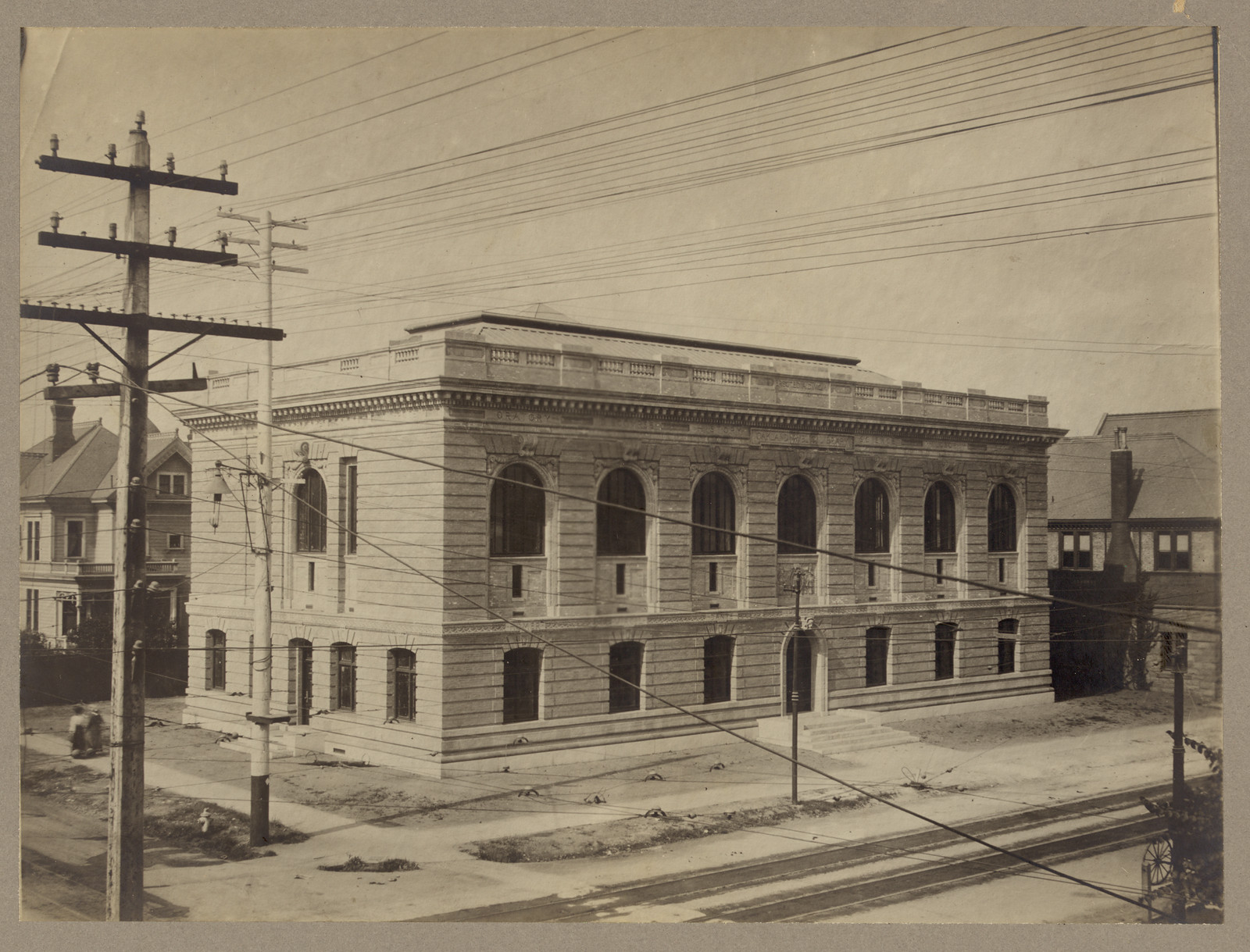 Exterior view of a stone public library building — historic image
