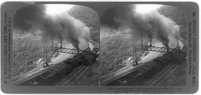 Rounding the bend, ascending the heavy grades (90 ft. to the mile) of the Horseshoe Curve, Penn. R'y, Allegheny Mts., Pa., U.S.A.