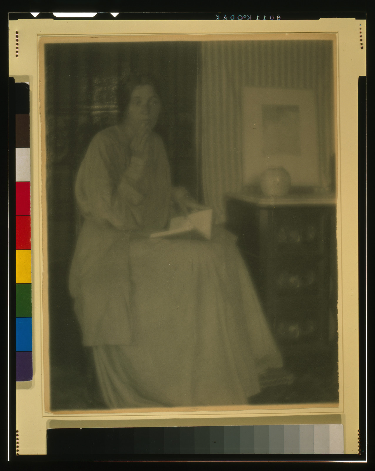 [Woman (Beatrice Baxter Ruyl), in dress, with open book in lap, and hand to face, seated], [1906] — historic photograph