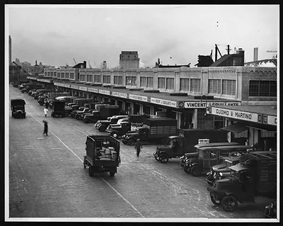 Delivery trucks lined up at a produce market
