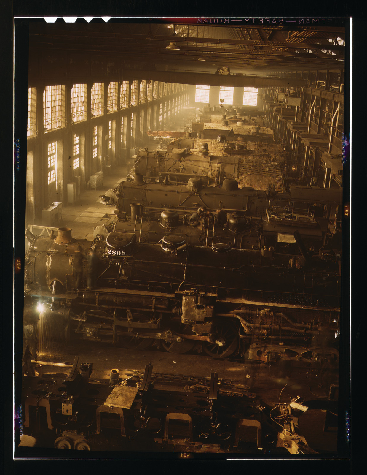 Steam locomotives in a railroad repair shop, number 2808 — historic image
