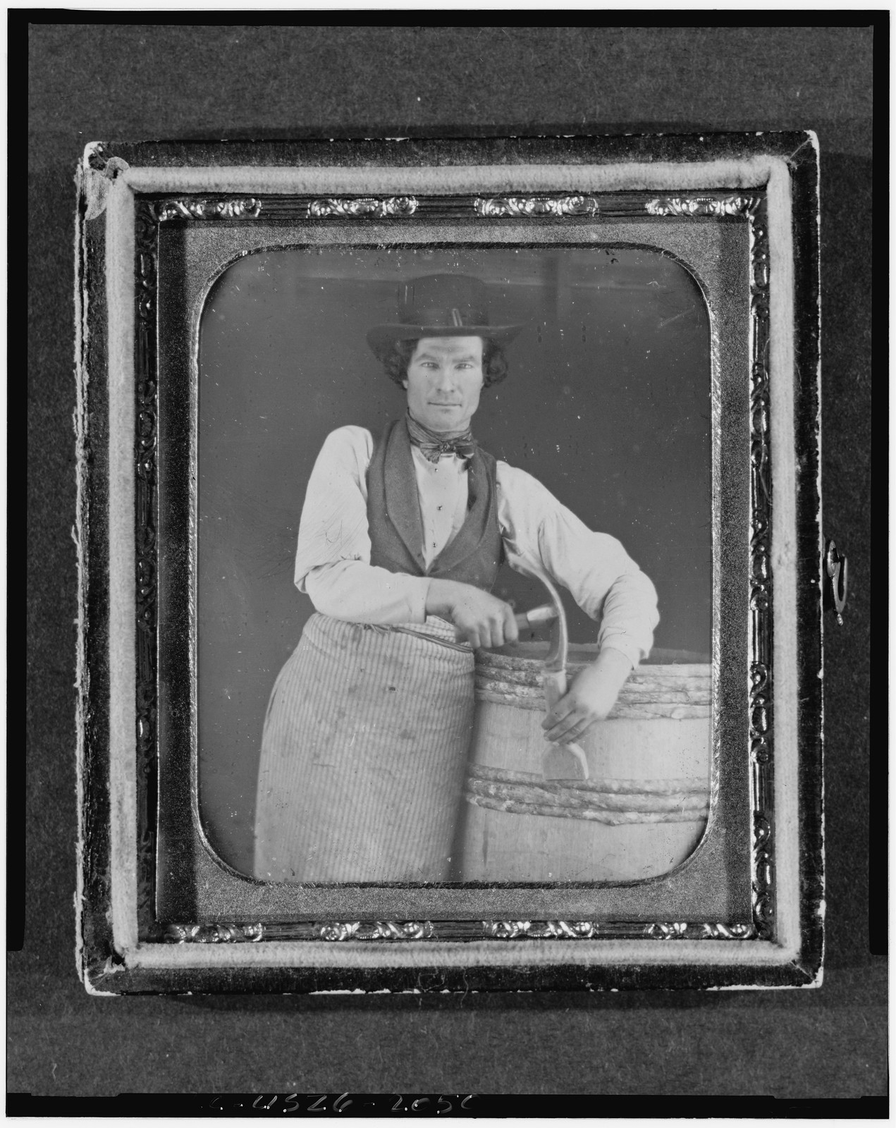 Daguerreotype portrait of a man with a barrel, 1840 — historic photograph