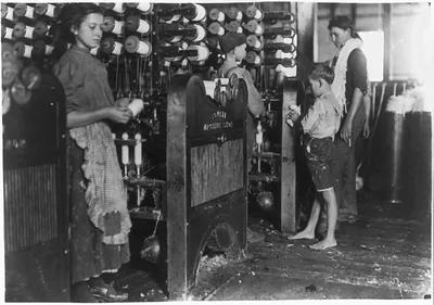 Cherryville Mfg. Co., Cherryville, N.C. One of the smallest boys. Doffer. Location: Cherryville, North Carolina.