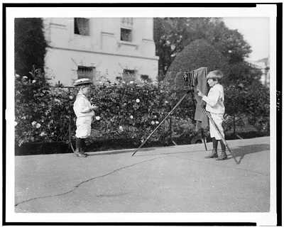 [Archie Roosevelt photographing Quentin Roosevelt outdoors]