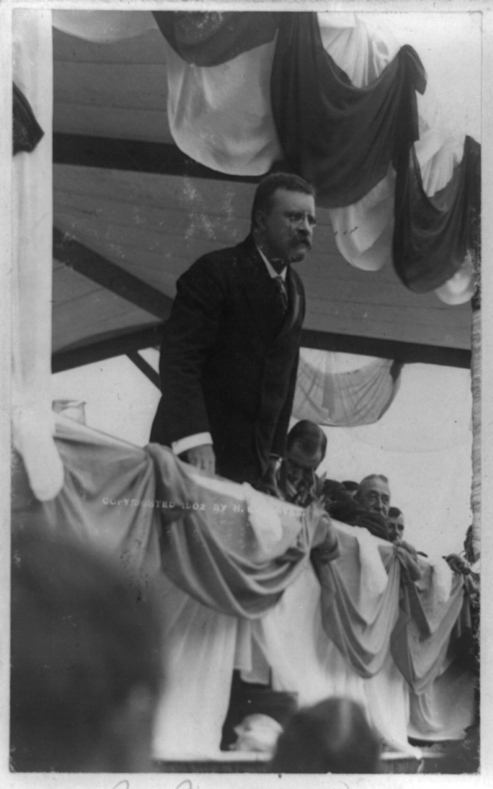 [Theodore Roosevelt, half-length portrait, standing, facing right, making speech at Worcester, Mass.], c1902. — historic photograph