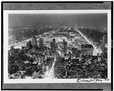 [Aerial view of New York City, at night, showing Central Park]
