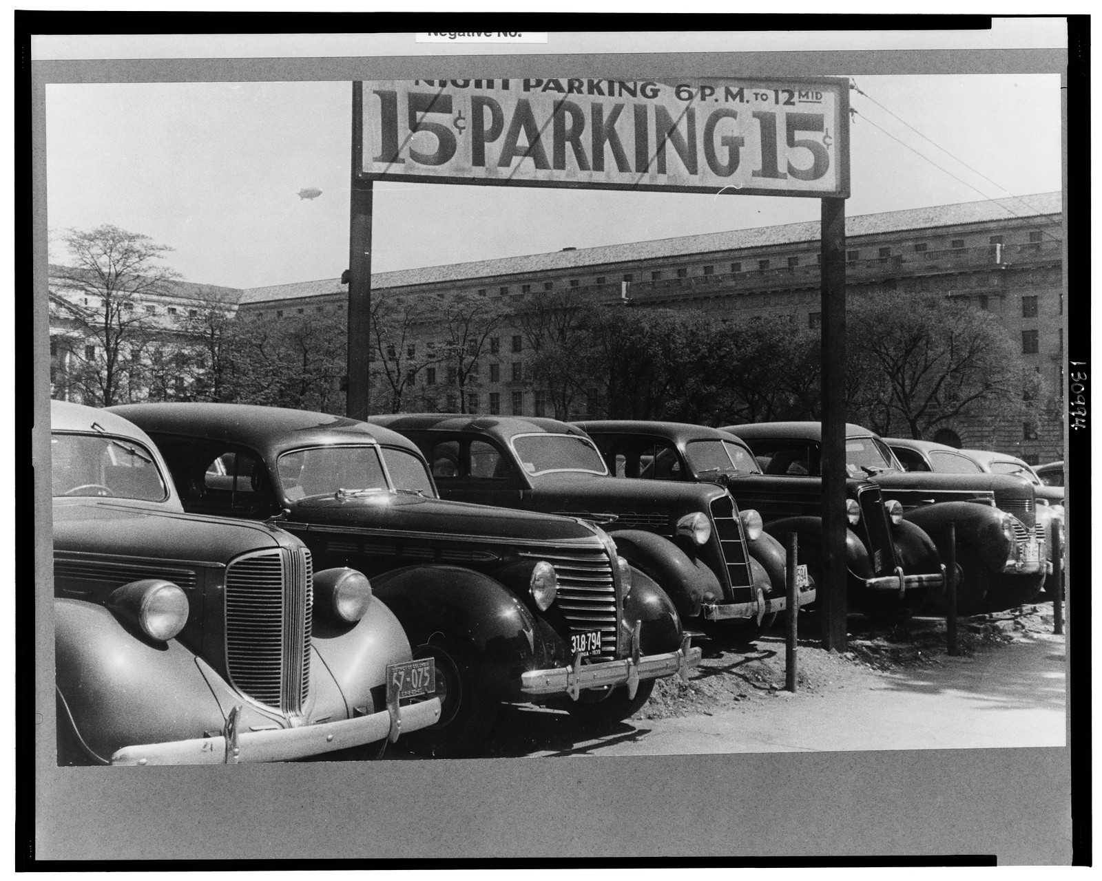 Washington, D.C. An automobile parking lot on 14th Street, back of the Department of Labor, 1939 — historic photograph