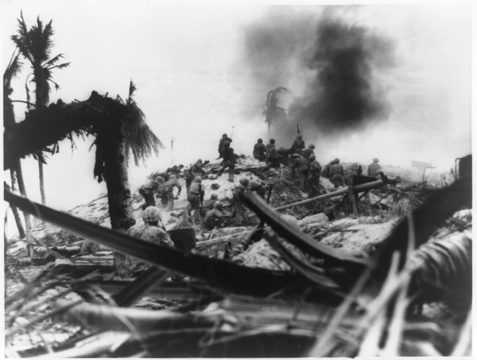 [Marines charging up hill at Tarawa to take a heavy reinforced concrete Japanese pill-box], 1943 — historic photograph
