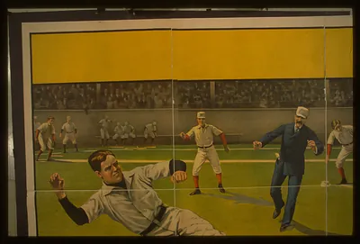 [Baseball player sliding into second base as throw arrives from third base]