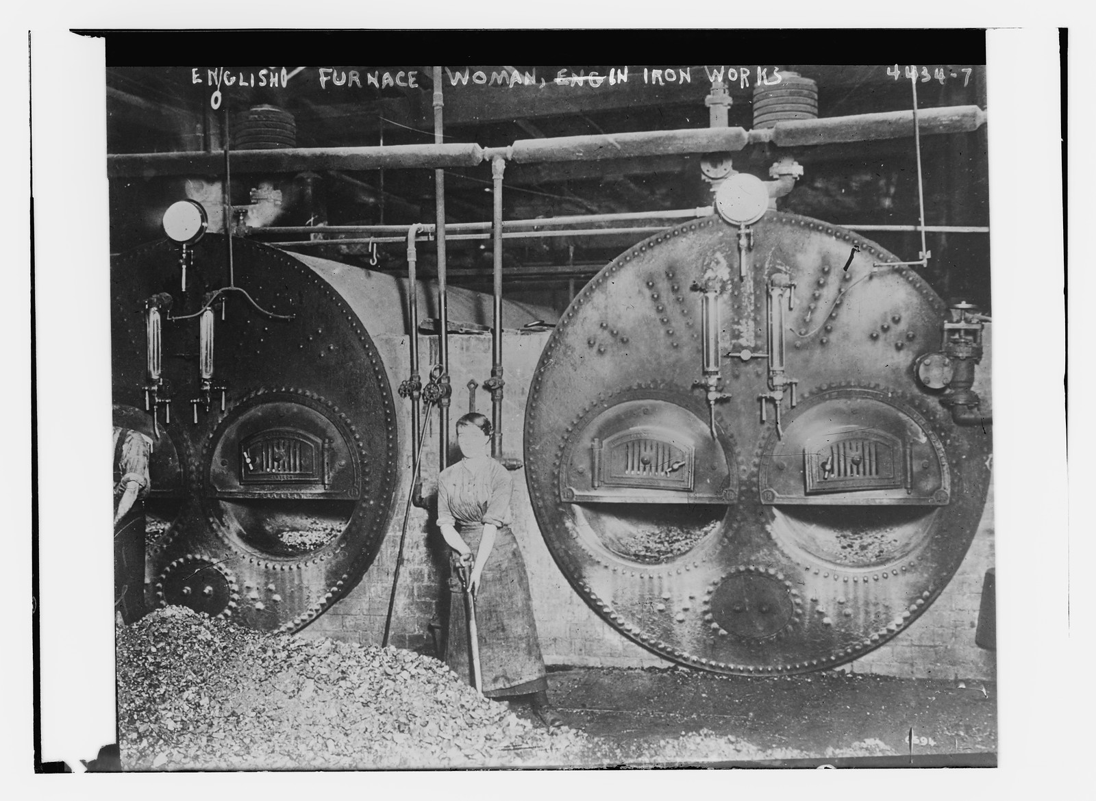 Engl. Furnace woman in iron works, n/a — historic photograph