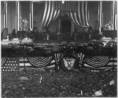 [Chief Justice Melville W. Fuller administering the oath of office to Benjamin Harrison on the east portico of the U.S. Capitol, March 4, 1889]