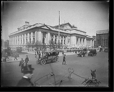 [Street traffic in front of New York Public Library]