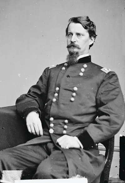 Seated Union officer in dark uniform, studio portrait