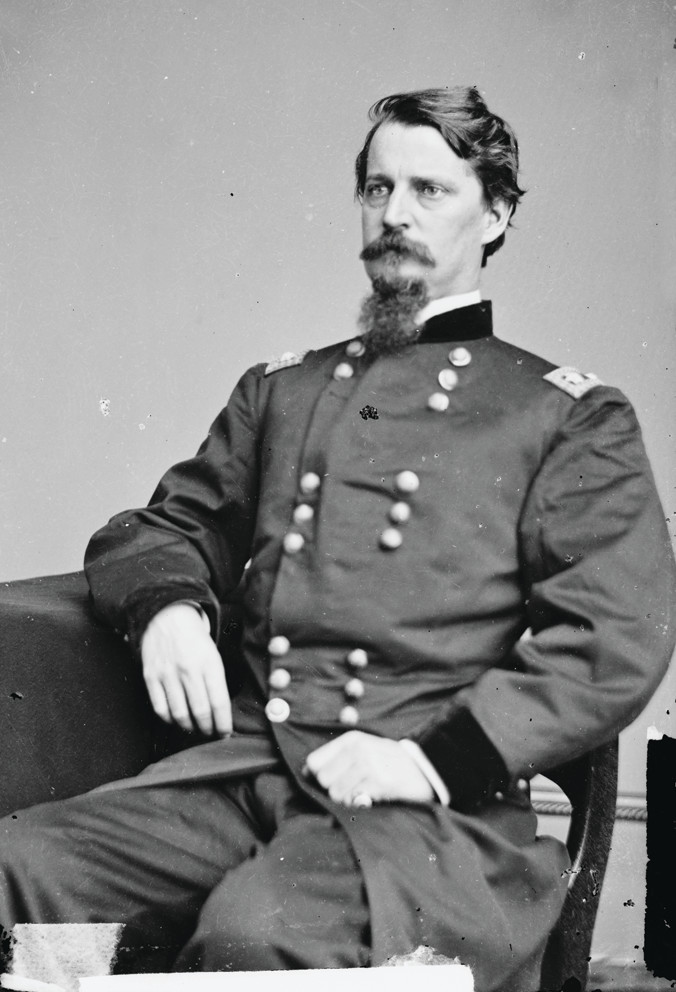 Seated Union officer in dark uniform, studio portrait — historic image