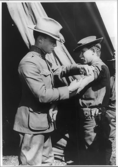 [U.S. Army medical officer vaccinating soldier with arm injection, San Antonio, Texas]