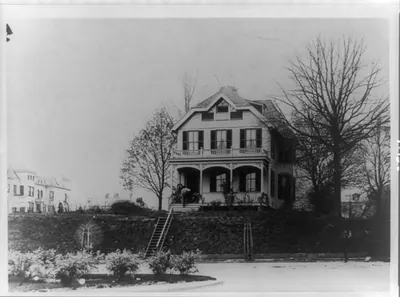 [William Tindall residence, Columbia Road and Connecticut Ave., Washington, D.C., with man entering front door]