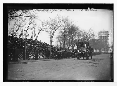 Crowd watching ladder wagon in Fire Dept. Exhibition, New York