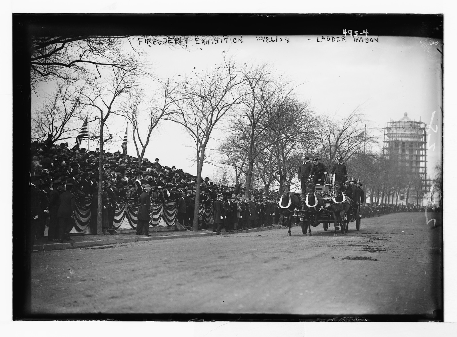 Crowd watching ladder wagon in Fire Dept. Exhibition, New York, Oct. 1908. — historic photograph