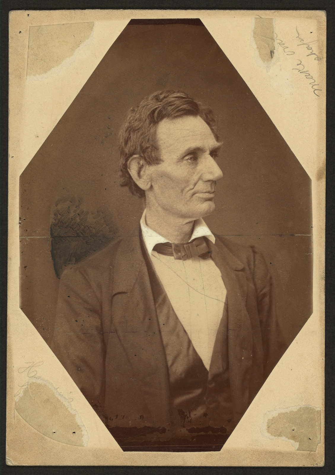 Abraham Lincoln, facing right, sepia photographic portrait — historic photograph
