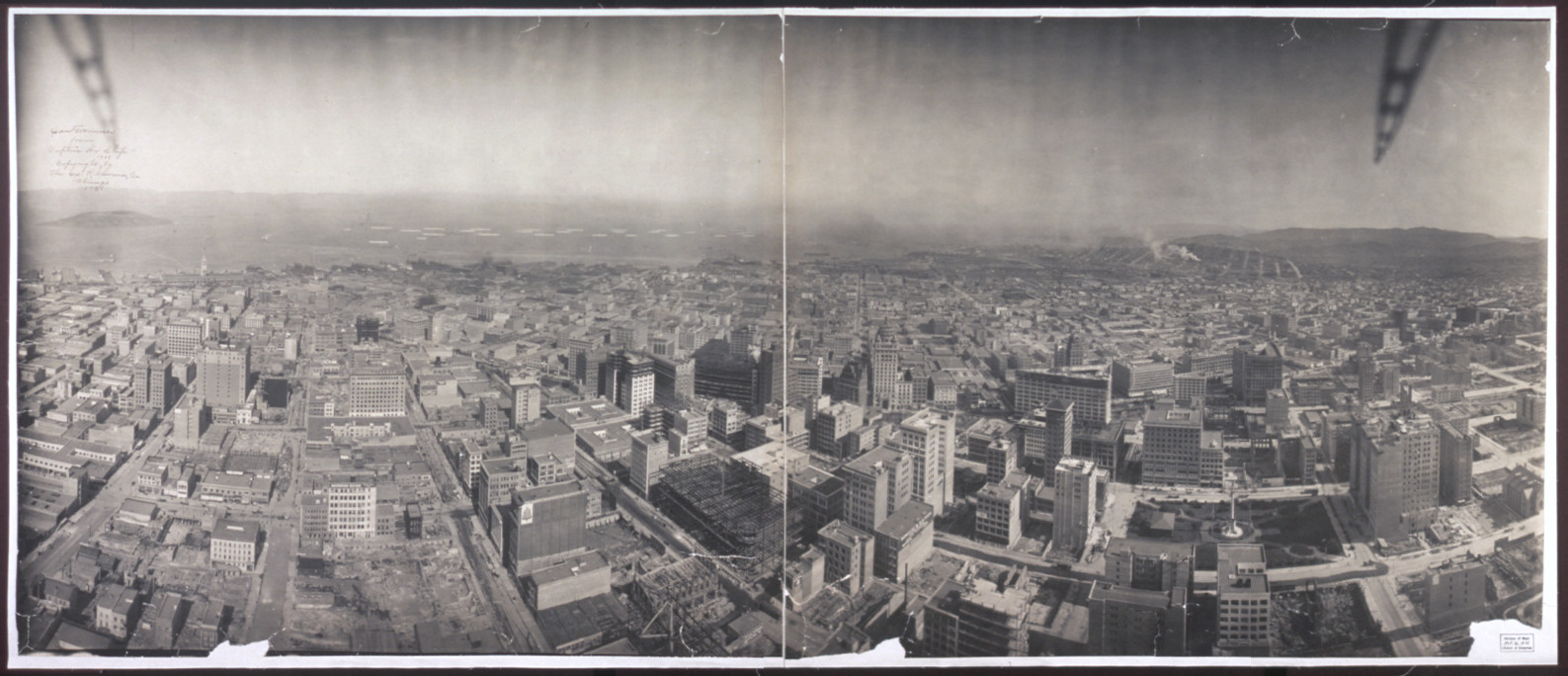 Panoramic aerial view of a city and bay — historic image