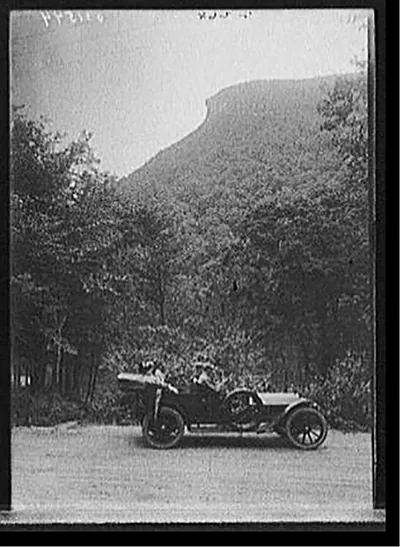 [Automobile in front of Old Man of the Mountain, White Mountains, N.H.]