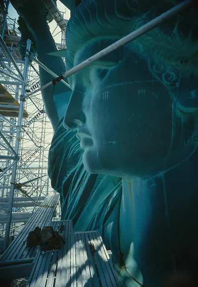 Statue of Liberty face and scaffolding, color photograph