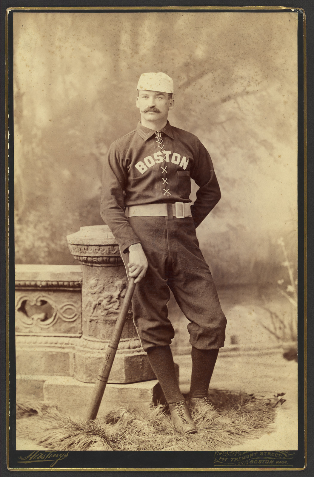 Baseball player in Boston uniform with bat, cabinet card photograph — historic photograph