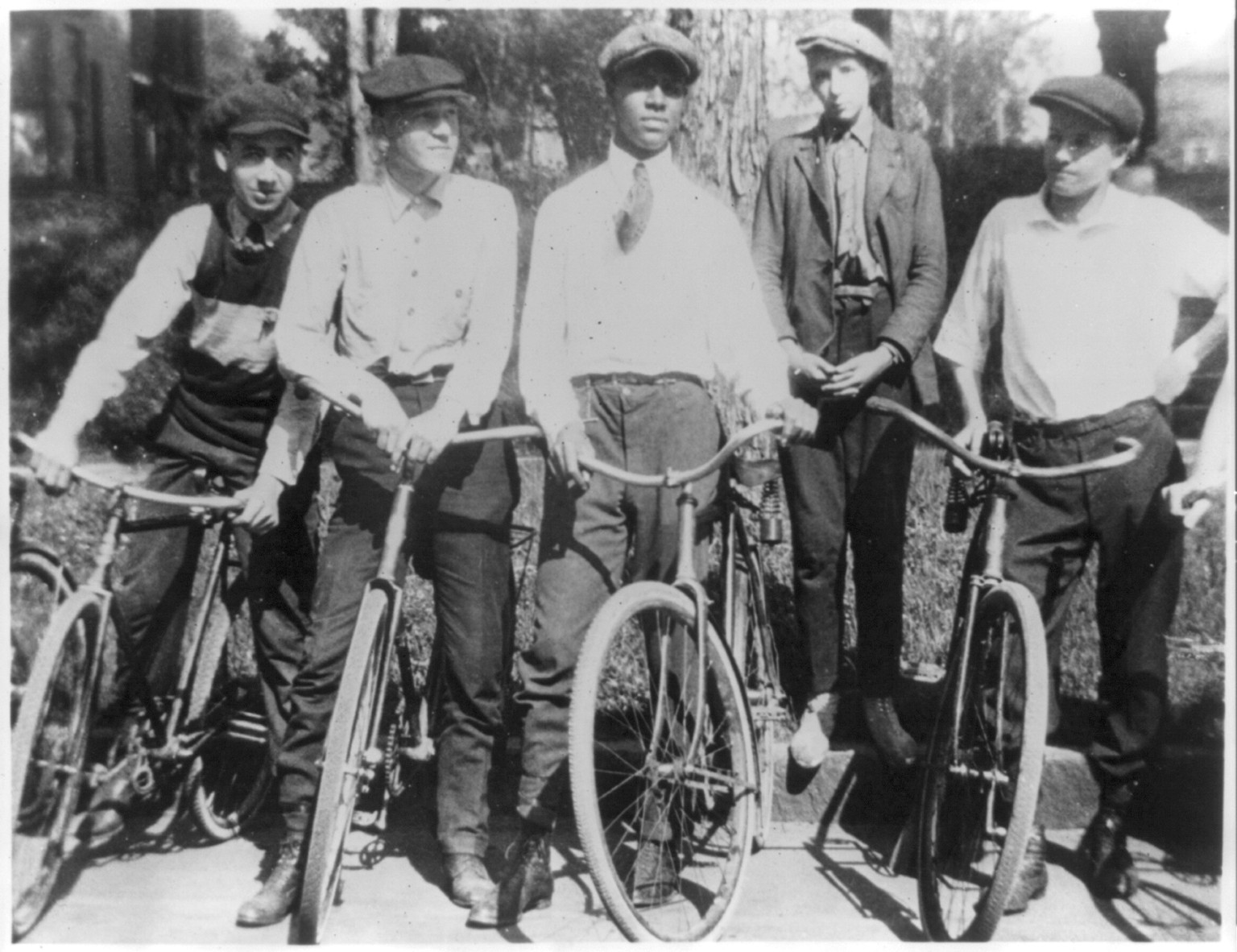 [Roy Wilkins with 4 boyhood friends during the period he was attending Mechanical Arts High School, before 1920, on a bike trip], [no date recorded on caption card] — historic photograph