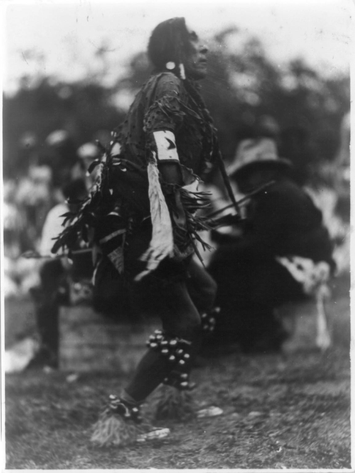 [Chief Turtle giving his interpretation of the Indians' storm dance, just before the rain came down in torrents, at the Indian celebration in Two Medicine Valley, Glacier National Park, Montana], c1920. — historic photograph