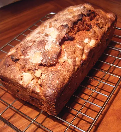 Loaf cake with chunks on a cooling rack