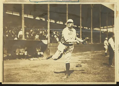 Baseball pitcher in Boston uniform on a ballpark field