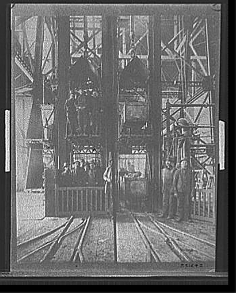 [Hoisting ore & lowering miners, Lead Homestake Mine], [between 1900 and 1910] — historic photograph