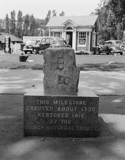 Milestone marked 10 with Quincy Historical Society plaque