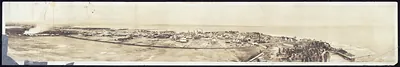 Panoramic view of a coastal town along a bay