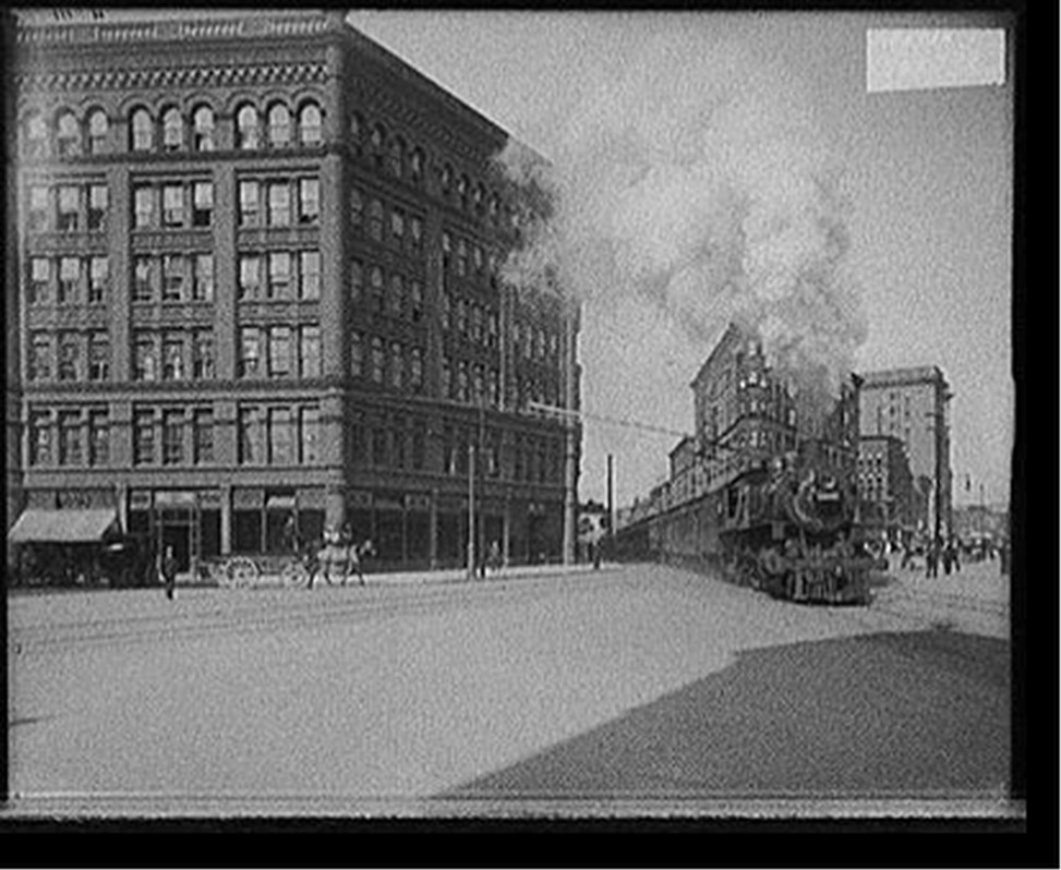 [Empire State Express (New York Central Railroad) passing thru Washington Street, Syracuse, N.Y.], [between 1900 and 1915] — historic photograph