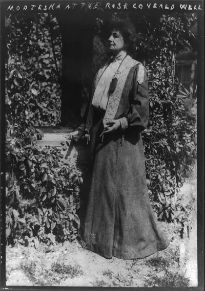 Modjeska at her rose covered well
