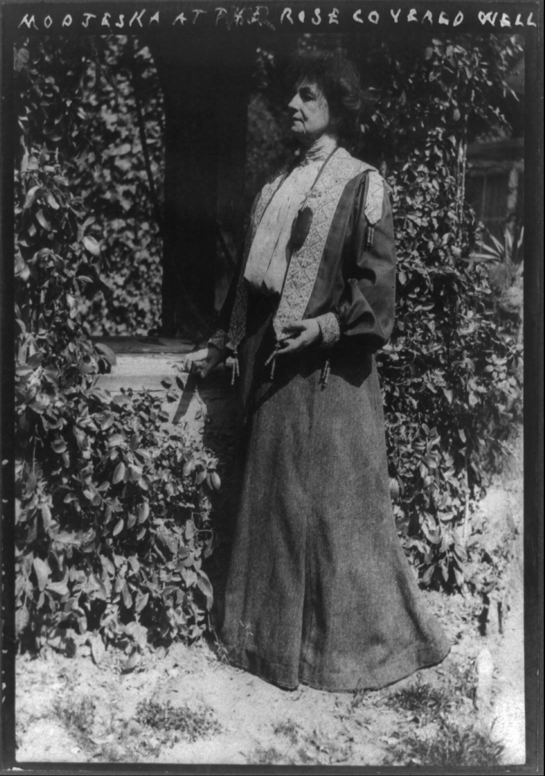 Modjeska at her rose covered well, c1909. — historic photograph