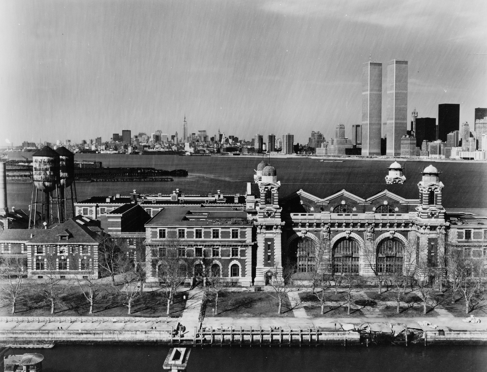 Ellis Island main building with Manhattan skyline behind — historic image