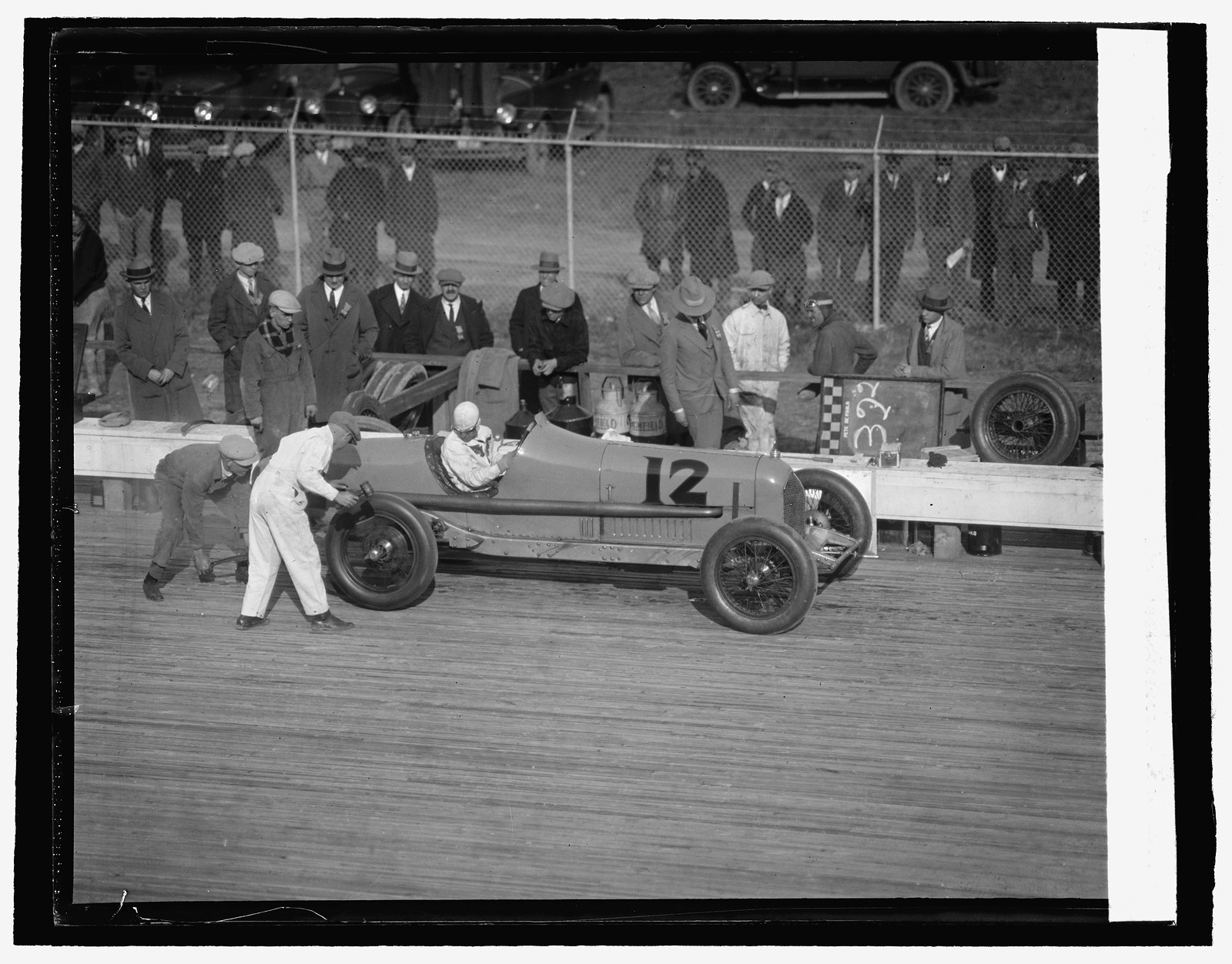 DePaolo in pit for tire change, 10/26/25, [19]25 October 26. — historic photograph