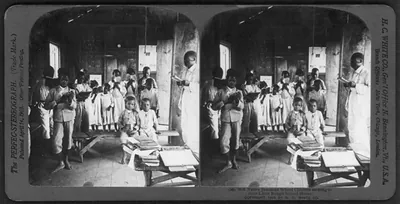 Native Jamaican school children reciting in their little rough school house