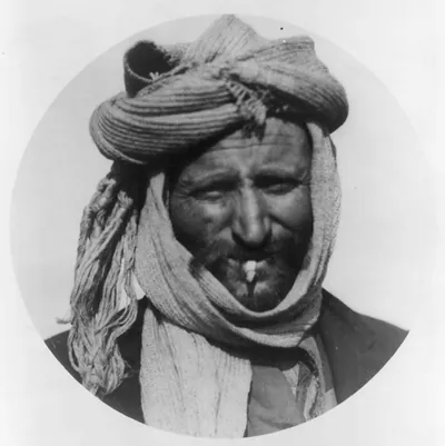 [Greek man from the Caucasus in camp at Salonica with scarf worn as hat; head]